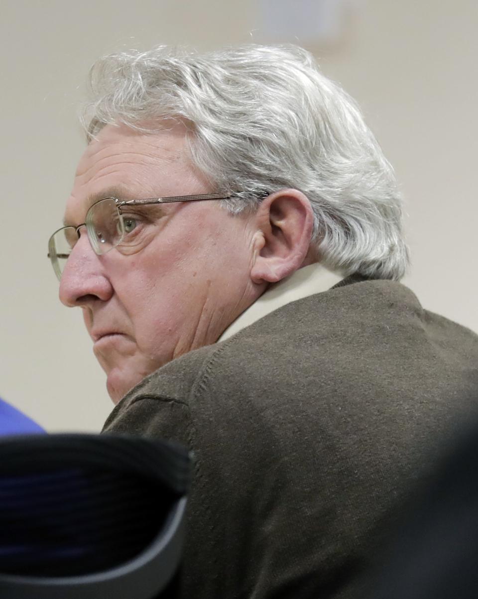 Grand Chute Town Supervisor Ron Wolff listens to opening statements during his trial Outagamie County Circuit Court on Wednesday in Appleton. Wolff is charged with having private interest in a public contract, a Class I felony, for accepting a landscaping contract with Grand Chute while serving as a member of the town board.