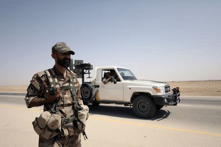 A fighter of Syrian Democratic Forces (SDF) is seen in the eastern Deir al Zor, Syria September 12, 2017.REUTERS/ Rodi Said