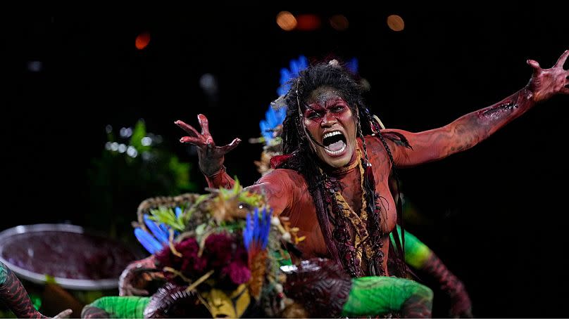 A performer from the Salgueiro samba school parades during Carnival celebrations at the Sambadrome in Rio de Janeiro, Brazil, 12 February 2024.