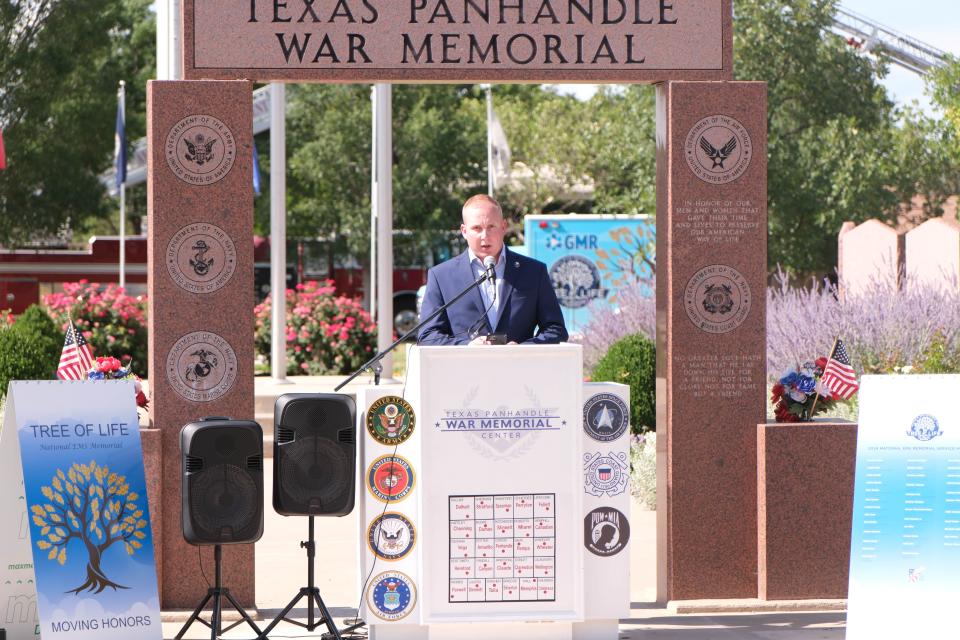 Amarillo Councilman and Potter County Fireman Josh Craft addresses the crowd at the Moving Honors Procession Wednesday at the Texas Panhandle War Memorial in Amarillo.