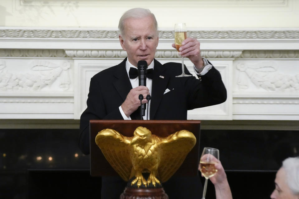 President Joe Biden toasts during a dinner reception for governors and their spouses in the State Dining Room of the White House, Saturday, Feb. 11, 2023, in Washington. (AP Photo/Manuel Balce Ceneta)