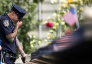 <p>A New York City Police Department (NYPD) officer breaks down while visiting the North pool during a commemoration ceremony for the victims of the September 11 terrorist attacks at the National September 11 Memorial, September 11, 2017 in New York City. (Photo: Drew Angerer/Getty Images) </p>