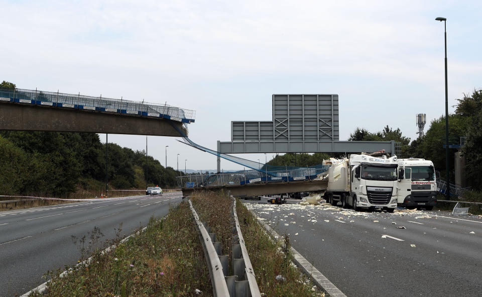 The lorry’s heavy load collided with the bridge (PA)