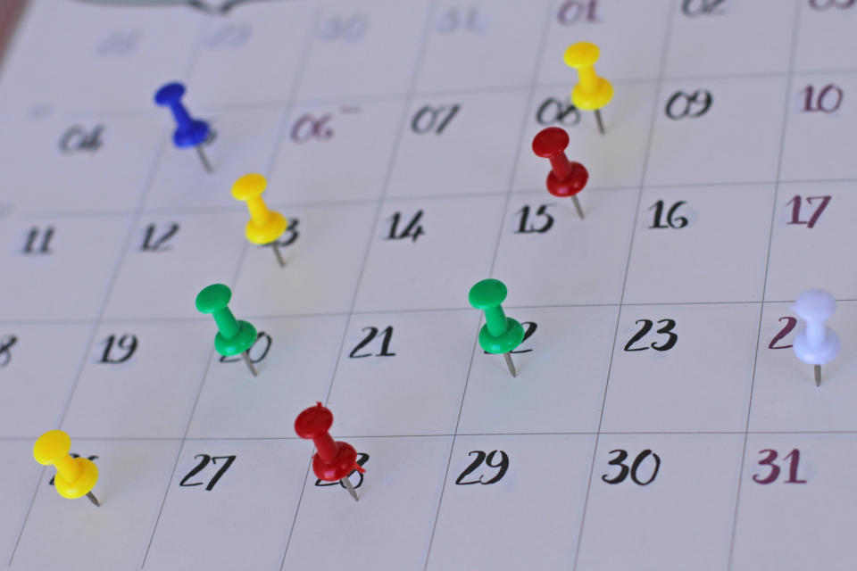 thumbtacks on a calendar