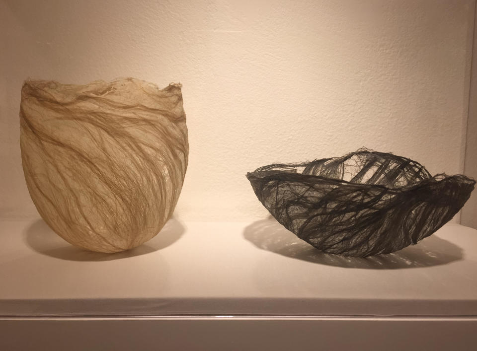 This photo taken on Dec. 2, 2016 shows two flax bowls made in 2008 by Berkeley, Calif., based 90-year-old fiber artist and weaver Kay Sekimachi. The pieces are part of the "Kay Sekimachi: Simple Complexity" exhibit the Craft and Folk Art Museum in Los Angeles, chronicling Sekimachi's decades-long career. The exhibit opened on Sept. 25, 2016, and runs through Jan. 8, 2017. (Solvej Schou via AP)