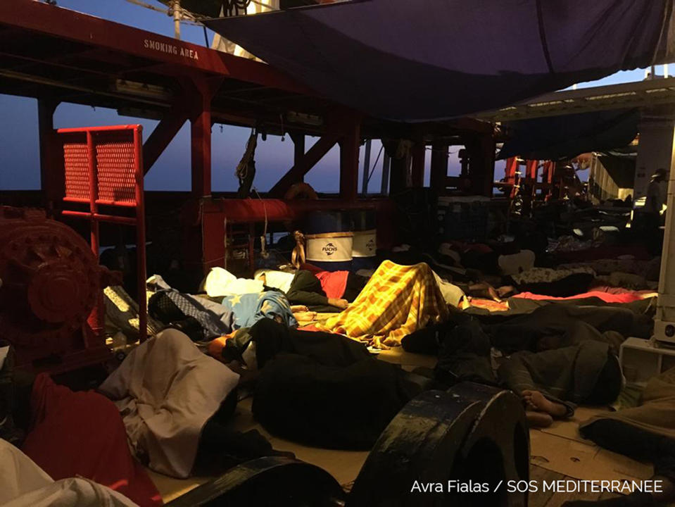 Rescued migrants sleep on the Ocean Viking, operated by SOS Mediterranee and MSF, as they cruise in the Mediterranean Sea, in the early hours of Friday, Aug. 23, 2019. Malta agreed Friday to disembark 356 migrants who were trapped for two weeks on the Ocean Viking, capping a week of standoffs between charities and governments that have exposed in dramatic ways Europe's inability to deal with migration from Africa. (Avra Fialas/SOS Mediterranee via AP)