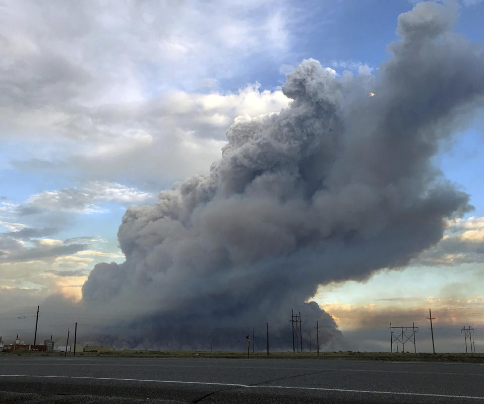 This photo provided by the U.S. Bureau of Land Management (BLM) shows wildfires burning in Idaho, Wednesday, July 24, 2019. The largest wildfire at the nation's primary nuclear research facility in recent history had been burning close to buildings containing nuclear fuel and other radioactive material, but a change in wind direction Wednesday was pushing the flames into open range at the sprawling site in Idaho, officials said. The lightning-caused fire at the Idaho National Laboratory is one of several across the U.S. West. (Bureau of Land Management via AP)