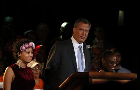 Democratic candidate for New York City mayor Bill de Blasio stands with his wife Chirlane and his daughter Chiara during his mayoral primary results party in New York September 10, 2013. REUTERS/Shannon Stapleton