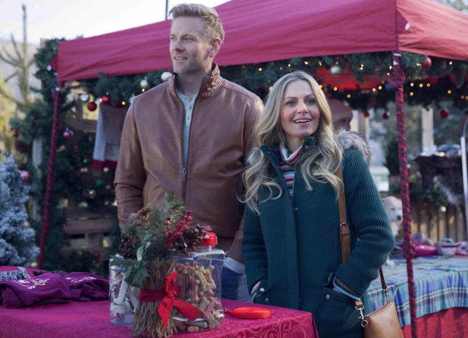 <p>Great American Media</p> Eric Johnson (left) and Candace Cameron Bure in <em>A Christmas Less Traveled</em>