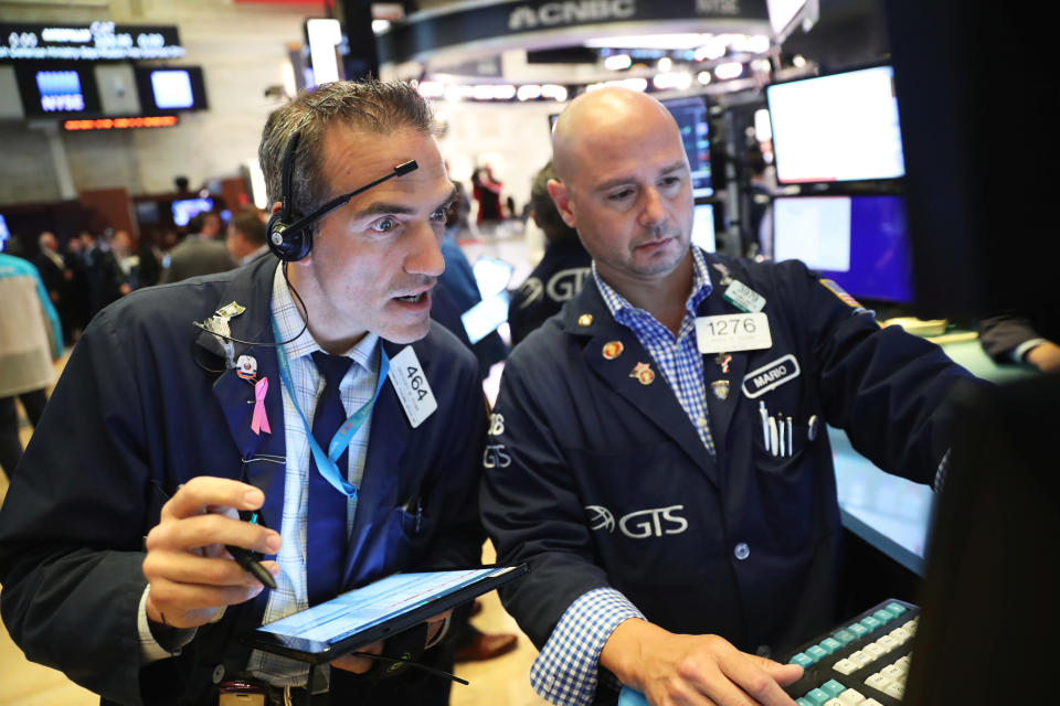 Traders work on the floor of the New York Stock Exchange shortly after the opening bell in New York, U.S., July 12, 2019. REUTERS/Lucas Jackson