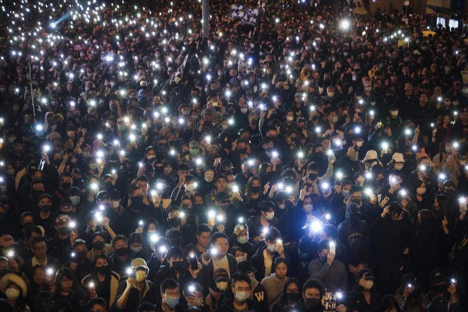 FILE - In this Sunday, Dec. 8, 2019 file photo, pro-democracy protesters flash their smartphone lights as they gather on a street in Hong Kong. Belarusian opposition figures, Hong Kong-pro-democracy activists, the Black Lives Matter movement, a jailed Russian opposition leader and two former White House senior advisers are among this year’s nominations for the Nobel Peace Prize. The 2021 deadline has passed and some of those who nominated people have spoken up. (AP Photo/Vincent Yu, File)