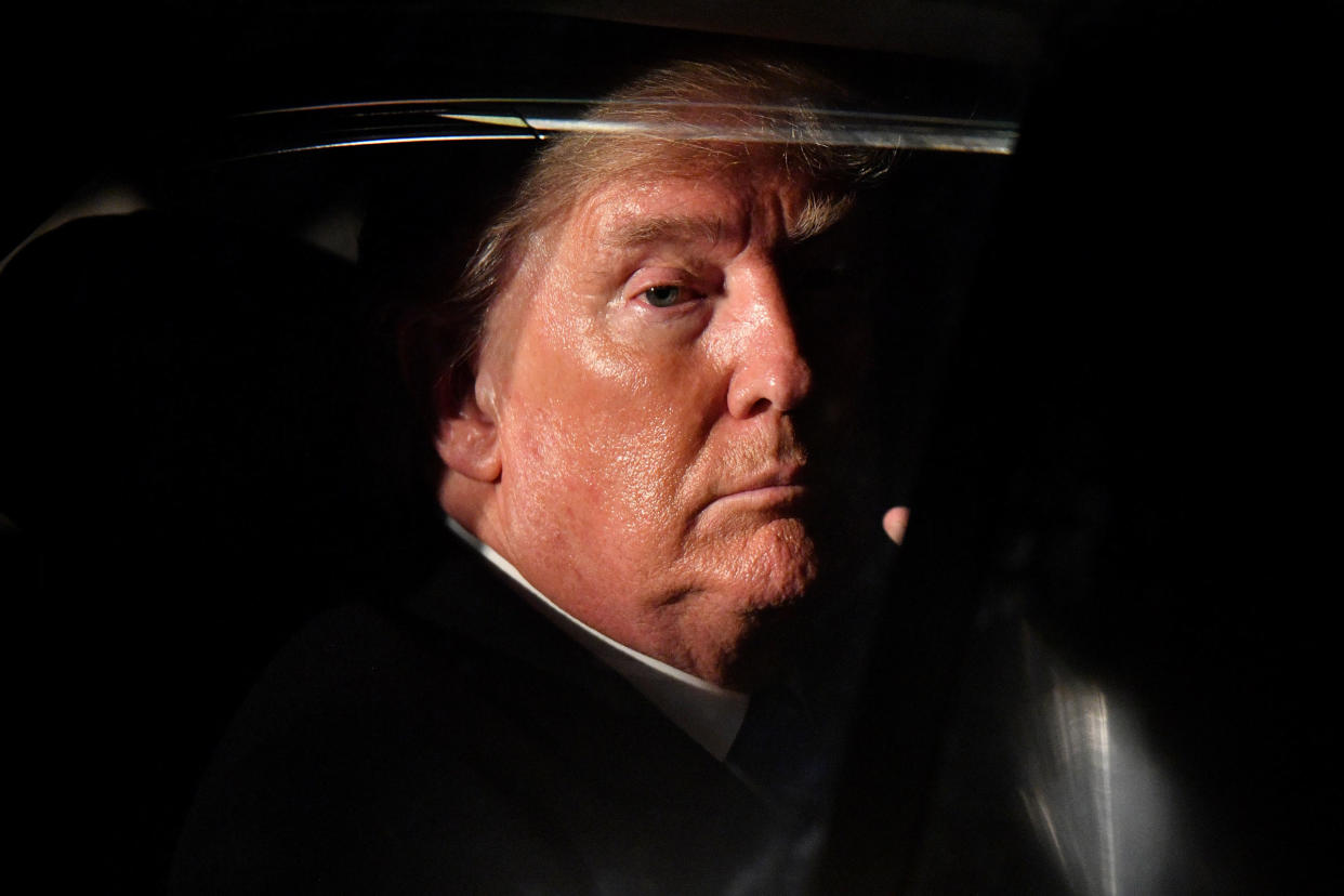 donal-trump-behind-car-window