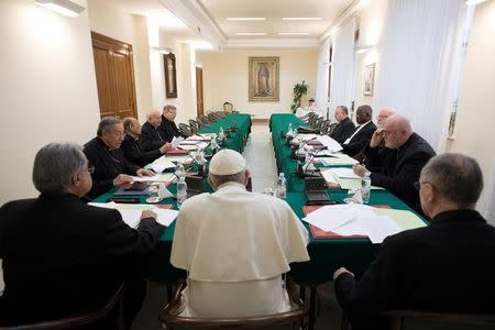 Pope Francis presides at a meeting of a permanent advisory group composed of nine high-ranking cardinals at the Vatican February 13, 2017. Osservatore Romano/Handout via REUTERS