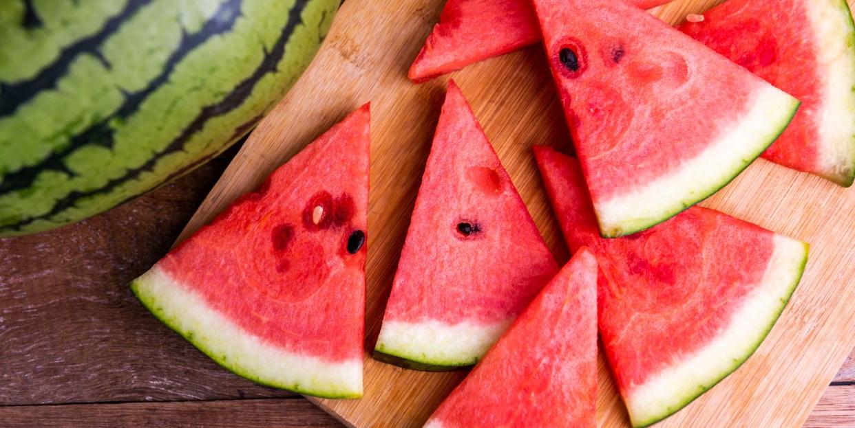 fresh ripe watermelon slices on wooden table