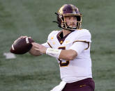 FILE - In this Nov. 7, 2020, file photo, Minnesota quarterback Tanner Morgan drops back to throw during the first half of an NCAA college football game against Illinois in Champaign, Ill. Morgan has big goals and an even bigger inspiration in mind for his fourth and perhaps final college season, following his father's death this summer after a bout with brain cancer. (AP Photo/Charles Rex Arbogast, File)