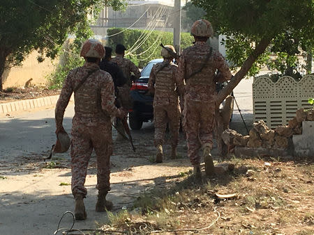 Paramilitary forces and police are seen during an attack on the Chinese embassy, where blasts and shots are heard, in Karachi, Pakistan November 23, 2018. REUTERS/Akhtar Soomro