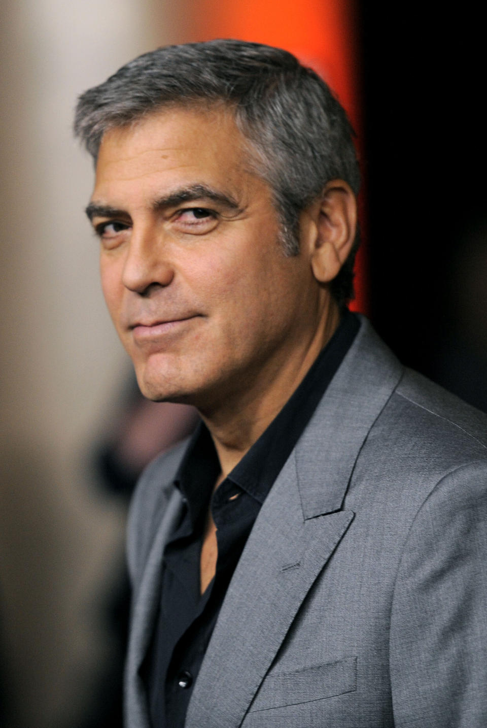 FILE - In this Feb. 6, 2012 file photo, George Clooney poses at the 31st Academy Awards Nominees Luncheon in Beverly Hills, Calif. Clooney is one of the world's leading celebrity contributor's to charity. (AP Photo/Chris Pizzello, File)