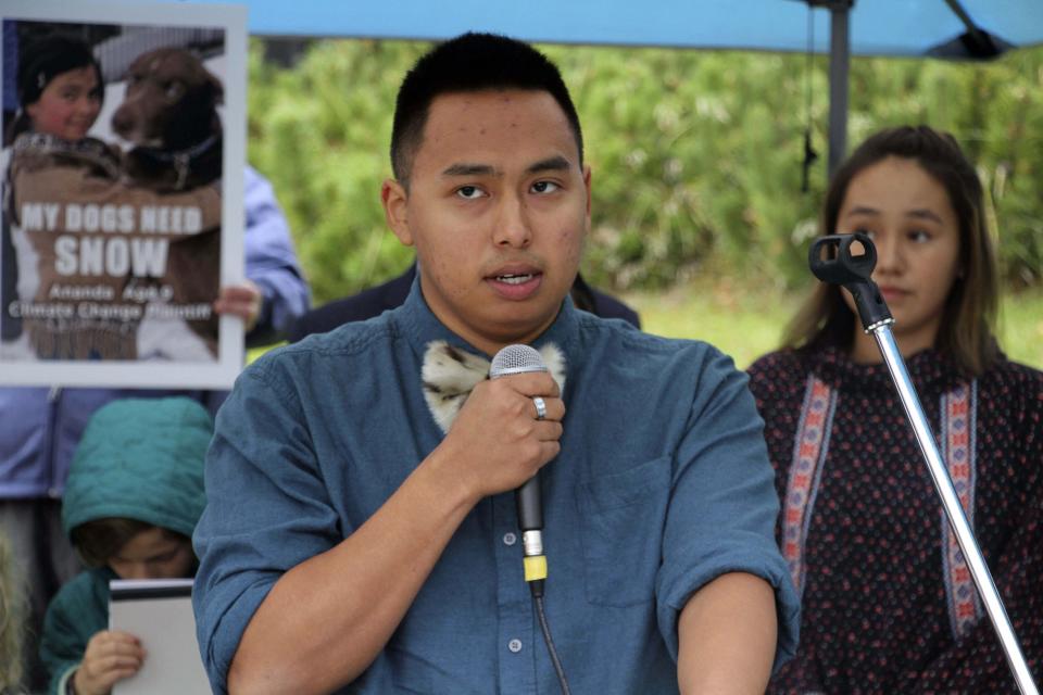 FILE - Esau Sinnok of Shishmaref, Alaska, speaks at a news conference after the Alaska Supreme Court heard arguments on Oct. 9, 2019, in Anchorage, Alaska, in a lawsuit that claims state policy on fossil fuels is harming the constitutional right of young Alaskans to a safe climate. The Alaska Supreme Court on Friday, Jan. 28, 2022, upheld the dismissal of a lawsuit filed by 16 Alaska youths, who claimed long-term effects of climate change will devastate Alaska and interfere with their individual constitutional rights. (AP Photo/Mark Thiessen, File)