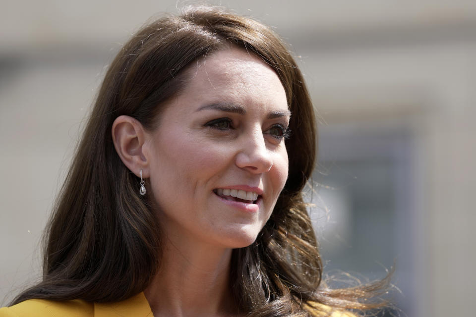 FILE - Britain's Kate, Princess of Wales, visits the Dame Kelly Holmes Trust and meets with some of the young people that the charity supports, May 16, 2023, in Bath, England. The scandal over Kate, Princess of Wales’ family snapshot — dubbed “photogate” — is a new chapter in the thorny relationship between the media and Britain’s royal family. (AP Photo/Kin Cheung, Pool, File)