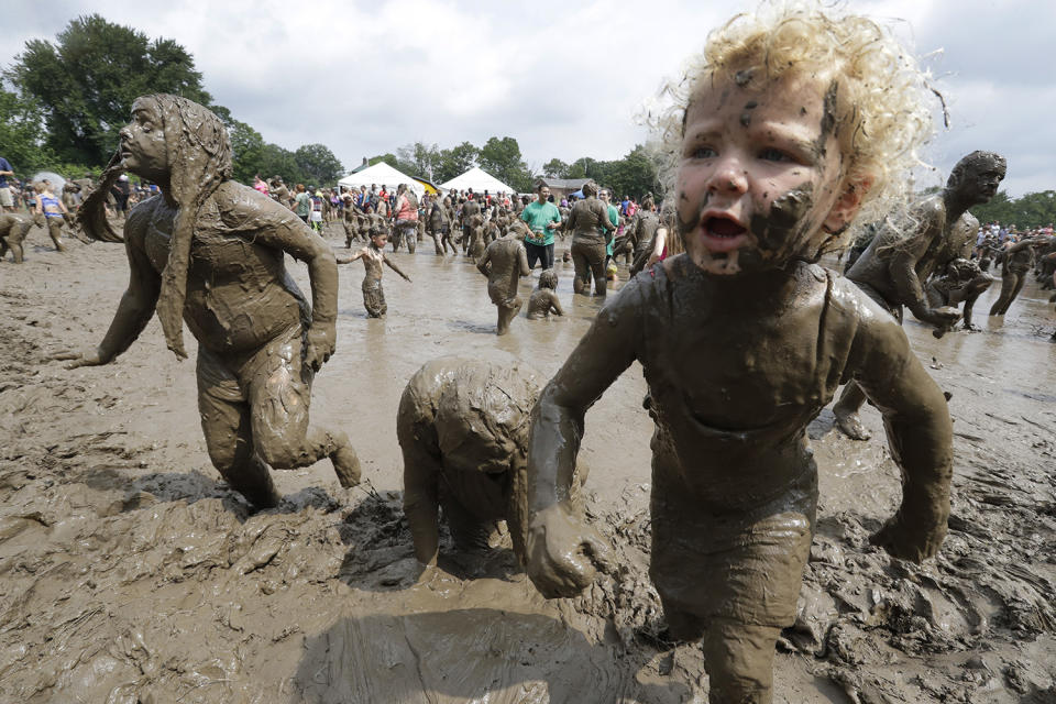 <p>Kids play in the mud during Mud Day at the Nankin Mills Park, July 11, 2017 in Westland, Mich. (Photo: Carlos Osorio/AP) </p>