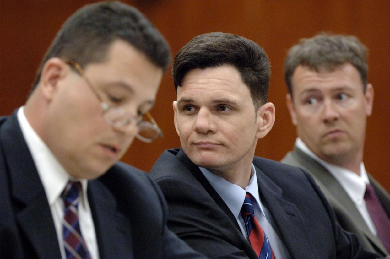 Jason Andrew Simpson (center), flanked by his attorneys Refik Eler (left) and Chuck Fletcher, observes opening arguments in his 2007 Jacksonville murder trial in the ax killings of Archie Crook Sr. and Kimberli Kimbler in 1999.