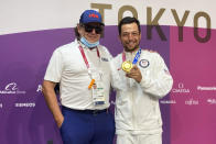 Xander Schauffele, of the United States, poses with his gold medal in the men's golf event with his dad, Stefan, at the 2020 Summer Olympics on Sunday, Aug. 1, 2021, in Kawagoe, Japan. (AP Photo/Doug Ferguson)