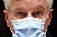 European Commission's Head of Task Force for Relations with the United Kingdom Michel Barnier leaves after addressing a media conference at an EU summit in Brussels, Thursday, Oct. 15, 2020. European Union leaders met in person for the first day of a two-day summit, amid the worsening coronavirus pandemic, to discuss topics ranging from Brexit to climate and relations with Africa. (Yves Herman, Pool via AP)