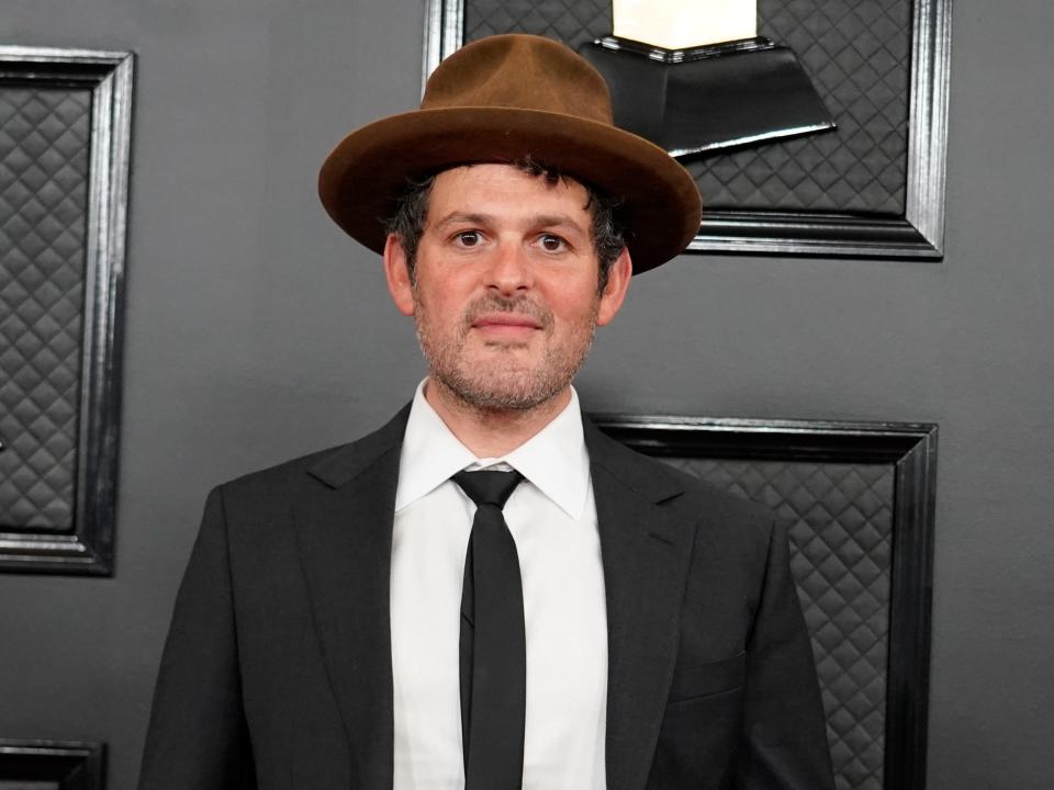 Gregory Alan Isakov posing on the red carpet at the grammys