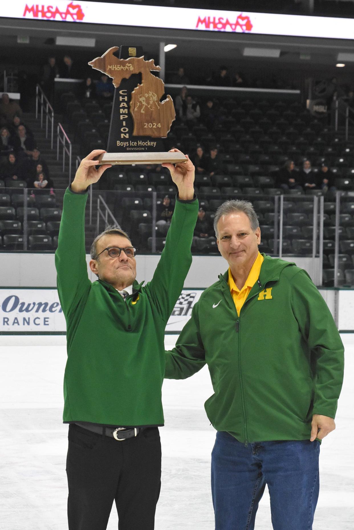 Rocky Johnson (left) coached Howell to two regional hockey championships in five seasons.