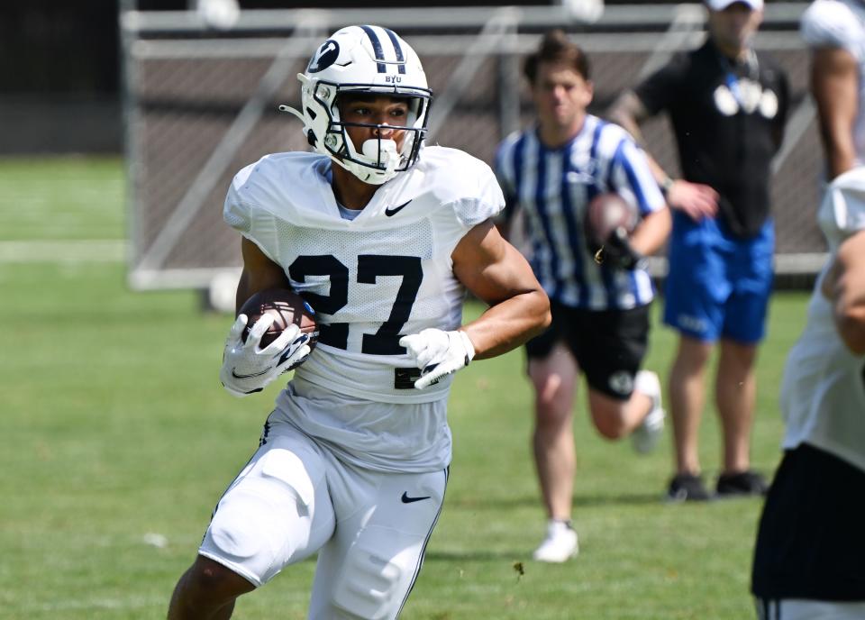 BYU running back LJ Martin looks for a pathway during practice in Provo on Tuesday, Aug. 8, 2023. | Scott G Winterton, Deseret News