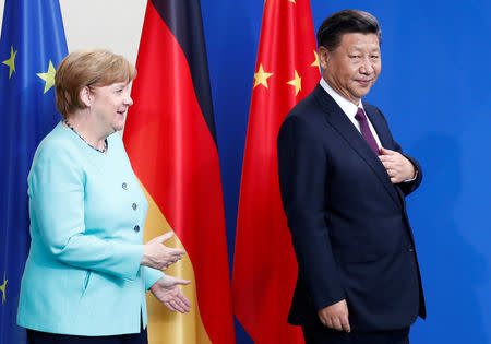 German Chancellor Angela Merkel and Chinese President Xi Jinping are seen after the news conference at the Chancellery in Berlin, Germany, July 5, 2017. REUTERS/Fabrizio Bensch