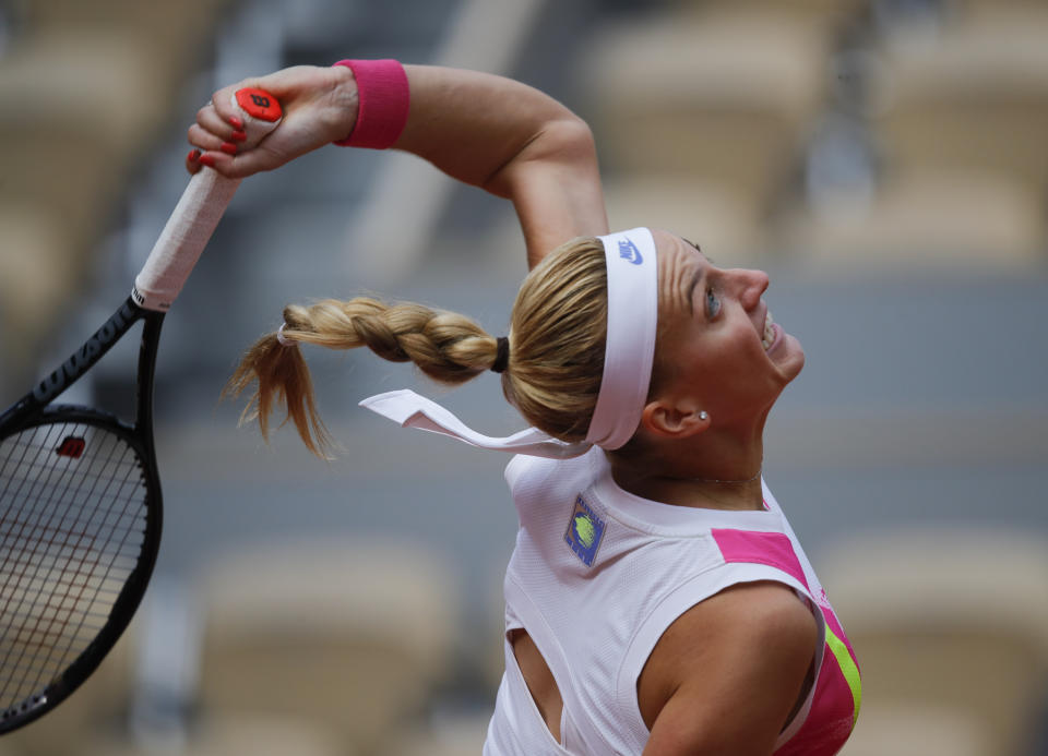 Petra Kvitova of the Czech Republic serves against Germany's Laura Siegemund in the quarterfinal match of the French Open tennis tournament at the Roland Garros stadium in Paris, France, Wednesday, Oct. 7, 2020. (AP Photo/Christophe Ena)