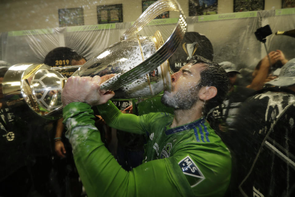 Seattle Sounders' Victor Rodriguez, who scored a goal in the match, drinks from the cup Sunday, Nov. 10, 2019, after defeating Toronto FC in the MLS Cup championship soccer match in Seattle. The Sounders won 3-1. (AP Photo/Ted S. Warren)