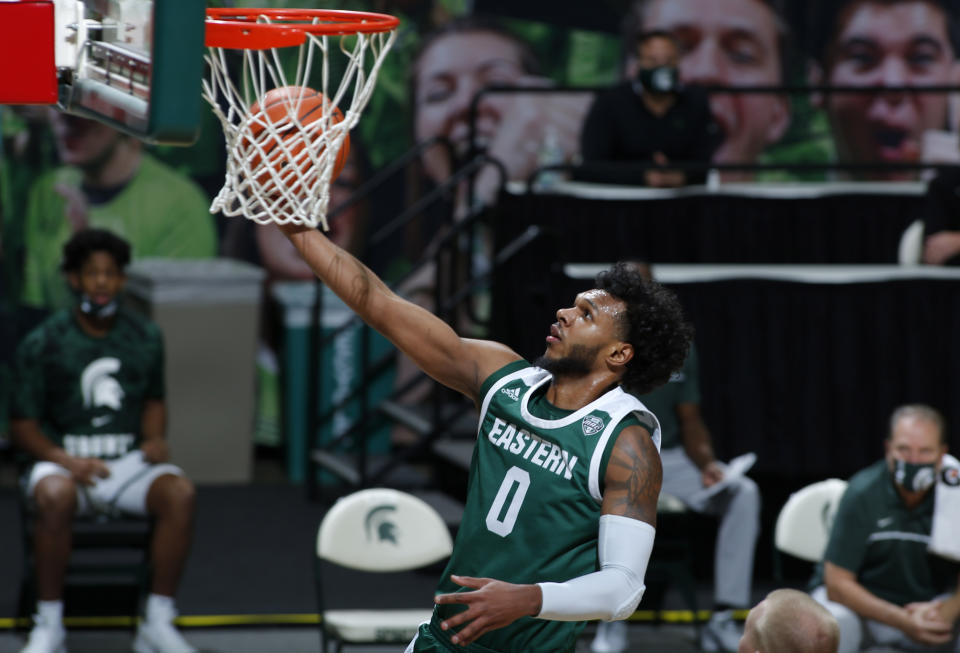 Eastern Michigan's Yeikson Montero goes up for a layup against Michigan State during the first half of an NCAA college basketball game, Wednesday, Nov. 25, 2020, in East Lansing, Mich. (AP Photo/Al Goldis)