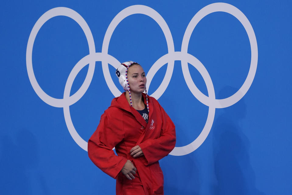 Anastasia Simanovich (8), of the Russian Olympic Committee, leaves the pool after a loss to the United States in a semifinal round women's water polo match at the 2020 Summer Olympics, Thursday, Aug. 5, 2021, in Tokyo, Japan. (AP Photo/Mark Humphrey)