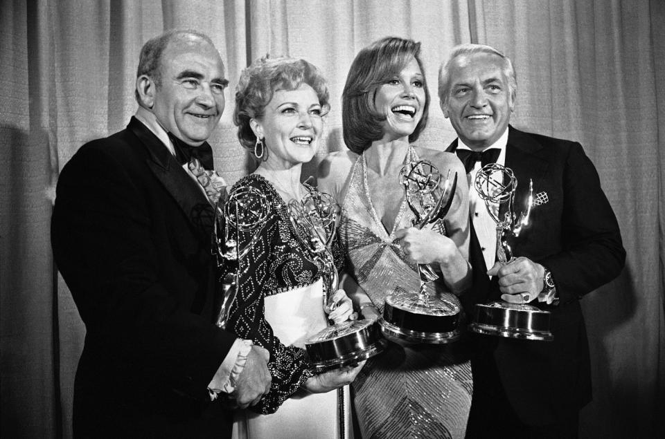 Members of the "Mary Tyler Moore Show" pose with their Emmys backstage