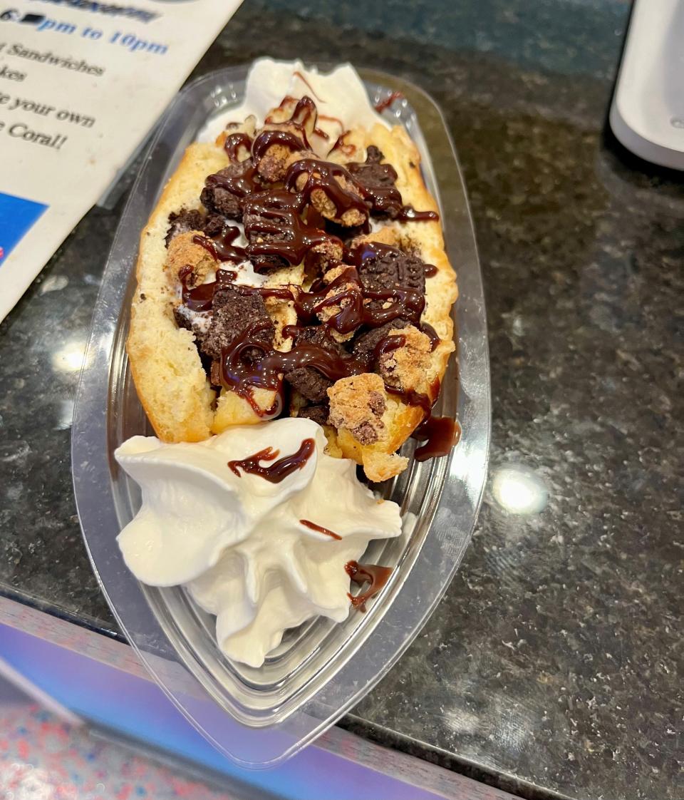 The Cookie Craze hot-pressed doughnut sandwich at Divine Donuts in Cape Coral has vanilla ice cream, Oreo and chocolate chip cookie pieces and chocolate drizzle.