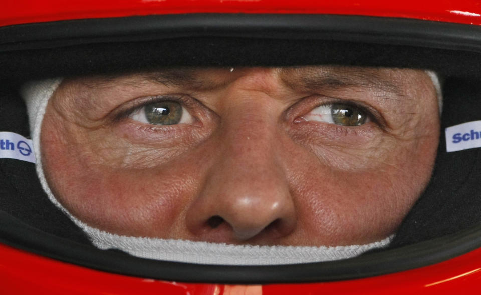 FILE - In this March 12, 2010 file photo Mercedes Grand Prix driver Michael Schumacher of Germany is pictured in the pits during the first practice session at the Formula One Bahrain International Circuit in Sakhir, Bahrain. Retired Formula One champion Michael Schumacher's condition was stable overnight, but the brain injury he suffered during a skiing accident in the French Alps is still critical, his manager said Wednesday Jan.1, 2014. (AP Photo/Ben Curtis, File)