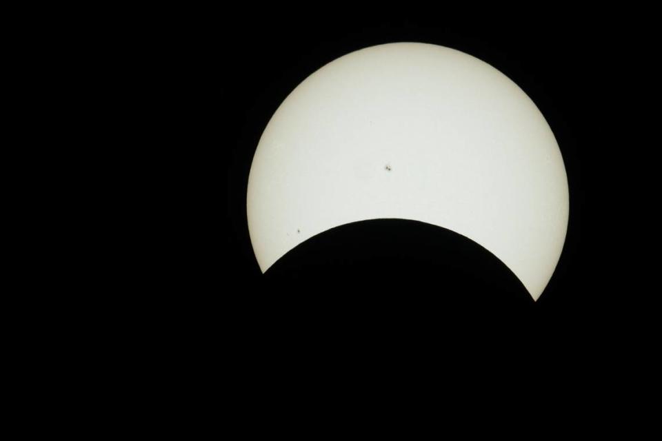 The solar eclipse hits its maximum coverage as viewed from Sacramento at the Museum of Science and Curiosity on Monday, April 8, 2024. Paul Kitagaki Jr./pkitagaki@sacbee.com