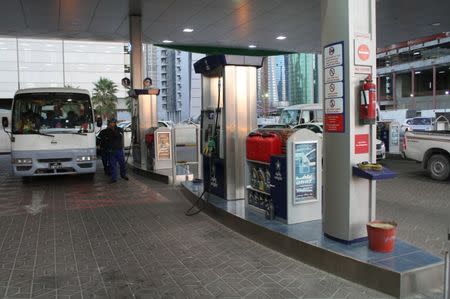 A van is refuelled at Woqod oil station in Doha, Qatar January 28, 2016. REUTERS/Naseem Zeitoon