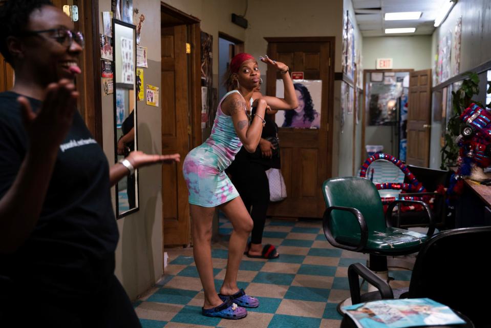 Raya York, 36, left, and Sonia Horton, 29, both of Detroit, practice their runway performance the night before Hair Wars at Beauty Village salon in Detroit on Saturday, Sept. 17, 2022.