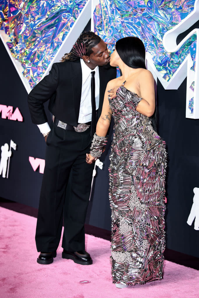 the couple kissing on the carpet