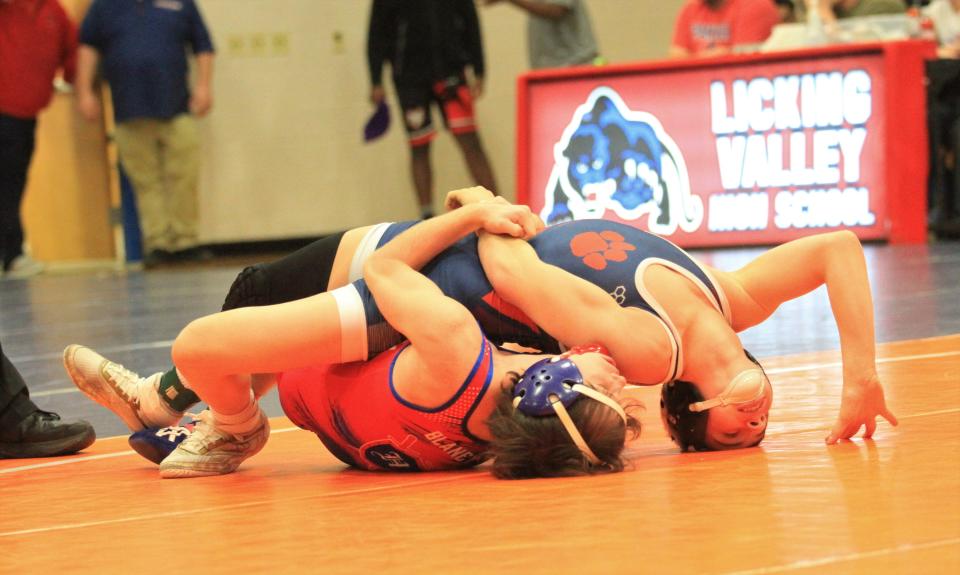 Highland sophomore Konner Blaney attempts to earn back points against Licking Valley sophomore Aiden McMahan in the 106-pound final during the Division II sectional tournament at Valley on Saturday, Feb. 25, 2023. Blaney won by pin.