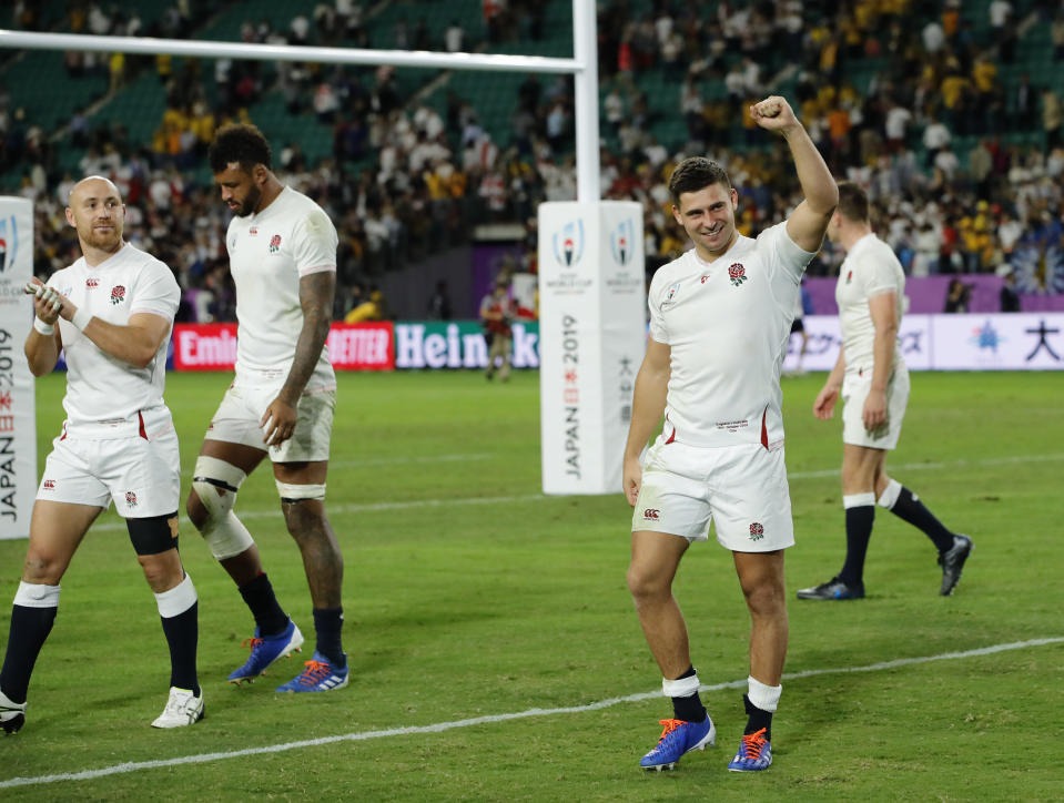 England players celebrate after winning over Australia in the Rugby World Cup quarterfinal match at Oita Stadium in Oita, Japan, Saturday, Oct. 19, 2019. (AP Photo/Christophe Ena)