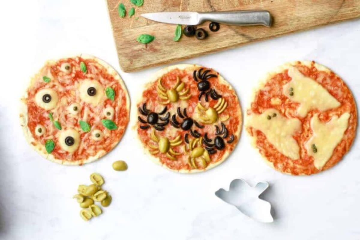 <p>Amy Treasure</p><p>It's fun to have more than one pizza for dinner; just mix up the toppings on your Halloween-themed pizza to get in the spirit of the day. Capers, sliced cheese and olives can help you achieve these simple ghost, spider and cyclop's pizzas. </p><p><strong>Get the recipe here: <a href="https://www.amytreasure.com/fun-halloween-pizza-ideas/" rel="nofollow noopener" target="_blank" data-ylk="slk:Fun Halloween Pizza Ideas;elm:context_link;itc:0;sec:content-canvas" class="link rapid-noclick-resp">Fun Halloween Pizza Ideas</a></strong></p>