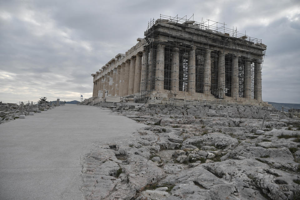 A view of the restorated path in front of the ancient Parthenon temple at the Acropolis hill, in Athens, Thursday, Dec. 3, 2020. Acropolis became fully accessible for people with disabilities after a restoration of the pathways and the inauguration of a new elevator. (Louisa Gouliamaki/Pool via AP)