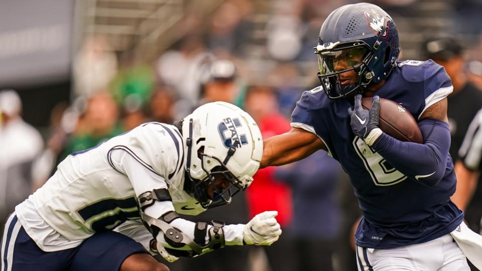 Sep 30, 2023; East Hartford, Connecticut, USA; UConn Huskies quarterback Ta'Quan Roberson (6) runs the ball against the Utah State Aggies in the first quarter at Rentschler Field at Pratt & Whitney Stadium.