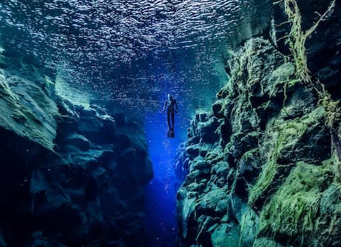 Diving in Þingvellir National Park - Credit: AP