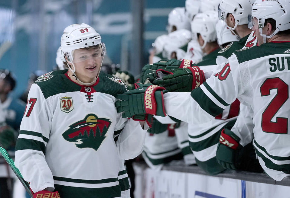 FILE - Minnesota Wild left wing Kirill Kaprizov (97) is congratulated by teammates after scoring a goal against the San Jose Sharks during the third period of an NHL hockey game in San Jose, Calif., in this Saturday, April 24, 2021, file photo. Though he has strong competition from Dallas Stars left wing Jason Robertson, Kaprizov has been the consensus favorite for the Calder Trophy since his debut.(AP Photo/Tony Avelar, File)