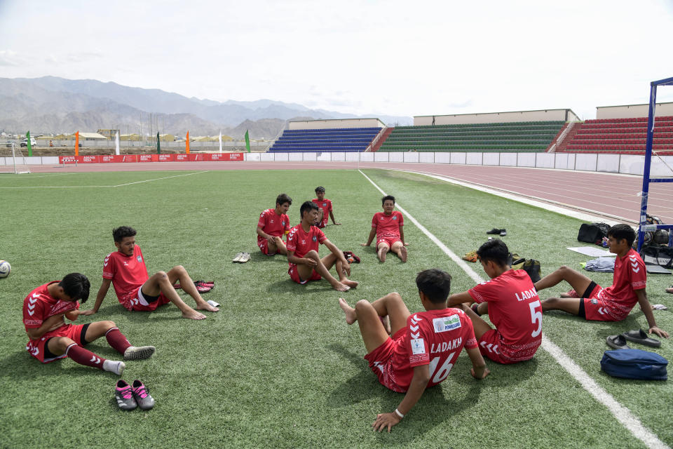 Players relax after a game at “climate cup” a first of its kind “climate-friendly” soccer tournament on the outskirts of Leh, Ladakh, India, Tuesday, Sept.5, 2023. The organizers say the matches are first in Asia to be held at an altitude of 11,000 feet, about 3,350 meters, and with a minimum carbon footprint. Ladakh is an ecologically fragile territory where oxygen is thin, and breathing is hard. (AP Photo/Stanzin Khakyab)